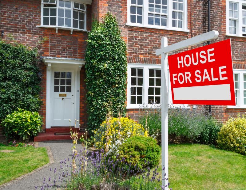 House exterior with for sale sign